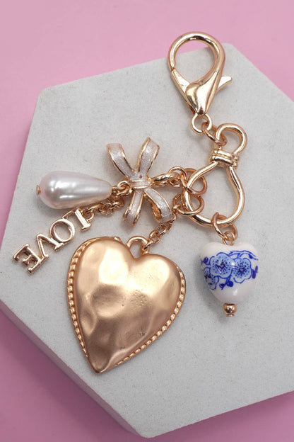 PORCELAIN BOW HEART LOVE BAG CHARM | Gold